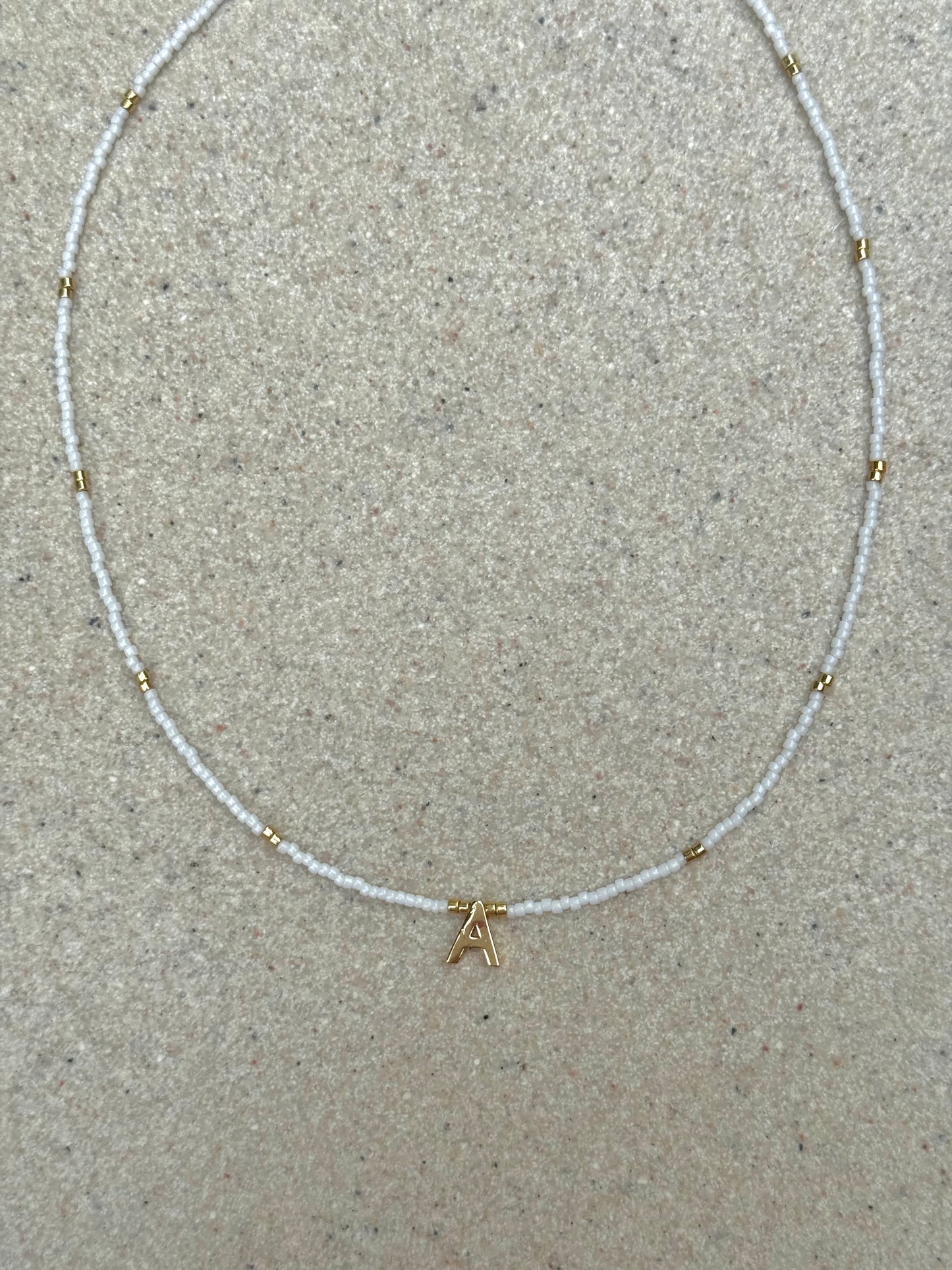 White and gold initial necklace