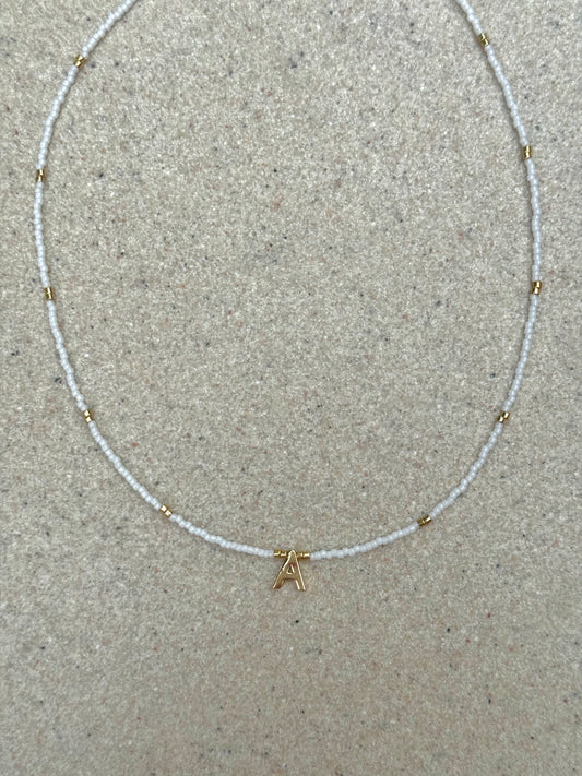 White and gold initial necklace